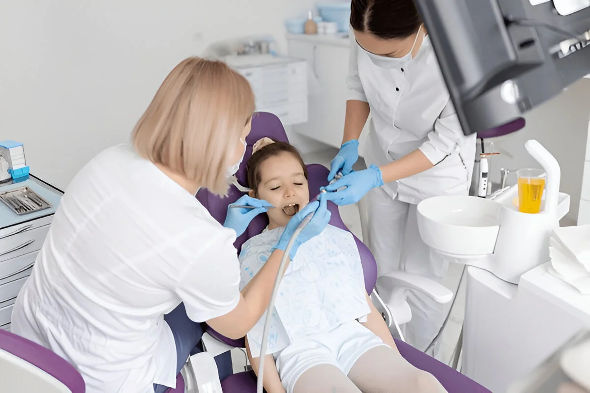 Dental sealants for kids Frisco TX at Dental Smart Kids: toddler smiling during gentle sealant application