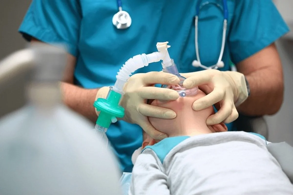 IV sedation Frisco TX child receiving monitored anesthesia with breathing mask at Dental Smart Kids